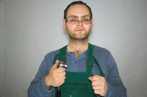 Worker with instruments in palm 스톡 사진