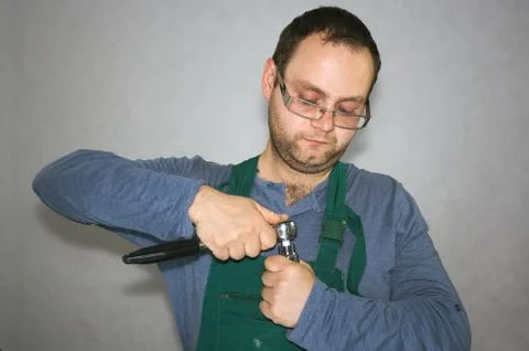 Worker with instruments in palm Stock Photos
