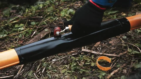 A worker insulates a joint between two plastic pipes. Stock Footage 318271368