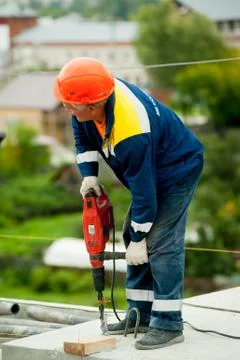 Worker with jackhammer to break up concrete Stock Photos