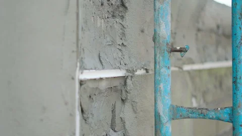 Worker labor building wall and UPVC groove line with plaster cement Stock Footage 89221350