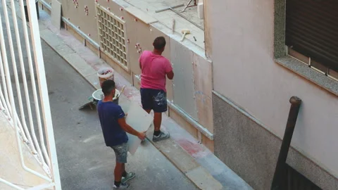 Worker labor building wall and UPVC groove line with plaster cement at house 動画素材 137226947