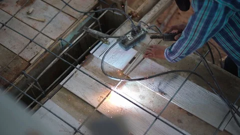 Worker labor welding wire metal for building Stock Footage 89617733