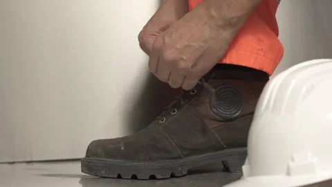 Worker lacing up leather boot Stock-Footage 319932726