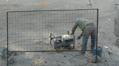 Worker launches engine of electrical generator Stock Footage 34991688