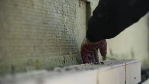 Worker Laying Bricks on Exterior Wall Video stock 296123803