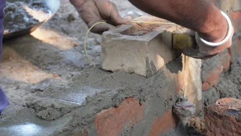 Worker laying bricks 스톡 동영상 332587575