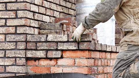 Worker Laying Bricks, Masonry Construction Process, Bricklayer at Work Stock Footage 330893293