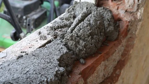 Worker is laying concrete over brick Stock Footage 75772446