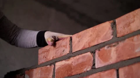 Worker lays out a brick wall Stock Footage 221782166
