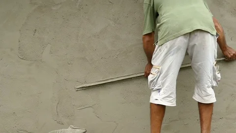 Worker Leveling Cement Render. Stock Footage 71110517