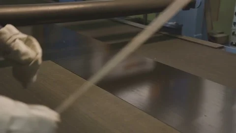 Worker Levels Flat Bar in Equipment Center at Plant Closeup Stock Footage 84515485