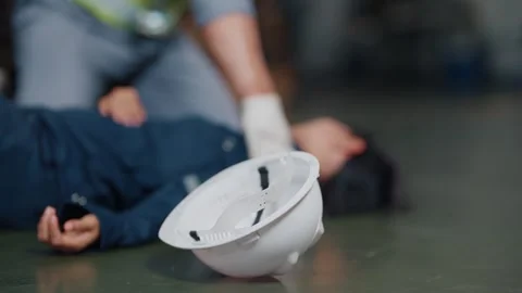 Worker lies motionless on concrete floor Stock Footage 340271118