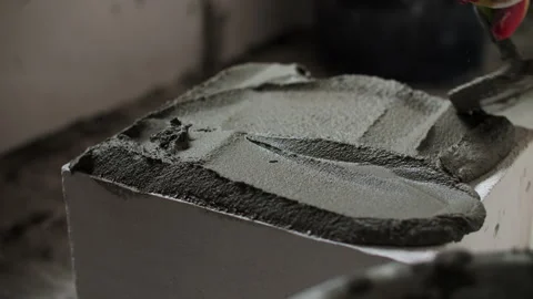 Worker lifting aerated concrete block Stock Footage 327747724
