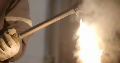 Worker lights a welding torch creating a giant flame Stock Footage 120619134