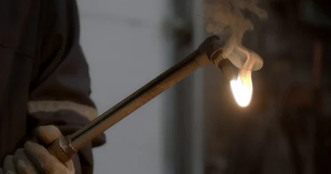 Worker lights a welding torch creating a giant flame Stock Footage 120619153