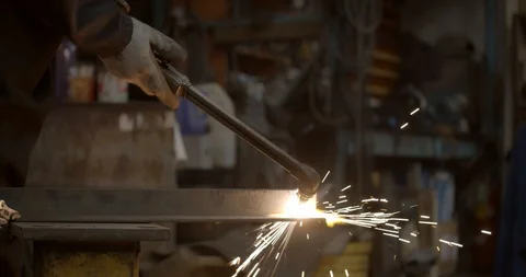 Worker lights a welding torch creating a giant flame Stock Footage 120619823