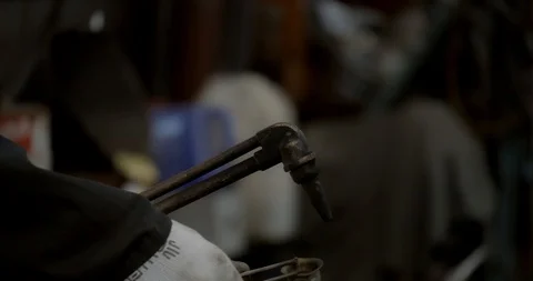 Worker lights a welding torch creating a giant flame Stock Footage 120643720