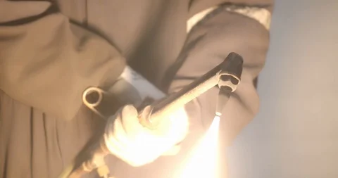 Worker lights a welding torch creating a giant flame Stock Footage 120644312