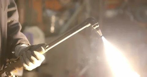 Worker lights a welding torch creating a giant flame Stock-Footage 141362236