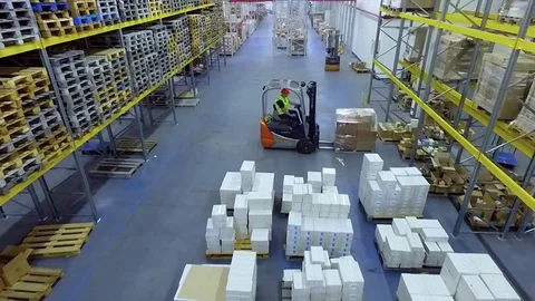 Worker loader loading goods boxes warehouse storage HD video. Forklift unload Stock Footage 72219325