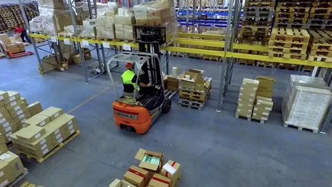 Worker loader loading goods boxes warehouse storage HD video. Forklift unload Video stock 72219328