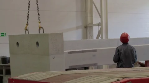 Worker Loading concrete structure on truck with a remote crane Stock Footage 83637322