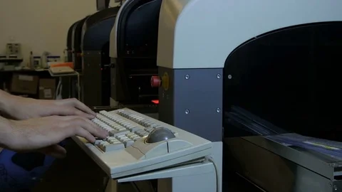 Worker loading data for production of electronic micro components by Pakito. Stock Footage 71244417