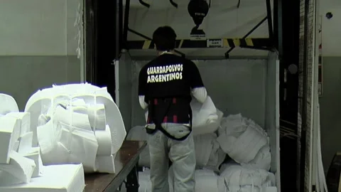 Worker Loading Fabric Bundles in Elevator, Buenos Aires, Argentina 库存影片 156436572