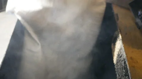 Worker is loading fuel into the boiler. Stock Footage 169288973