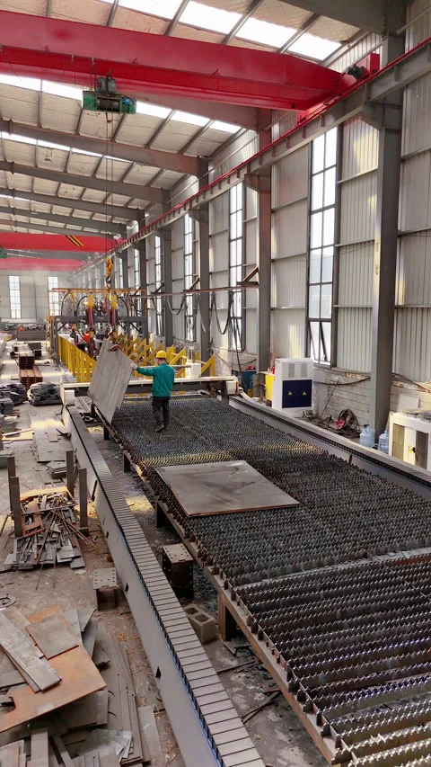 Worker loading sheet metal into laser cutting machine, industrial factory Stock Footage 335794738