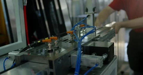 Worker Loads Metal Profile Into Pneumatic Clamping Station, Close Up Shot Stock Footage 340363594