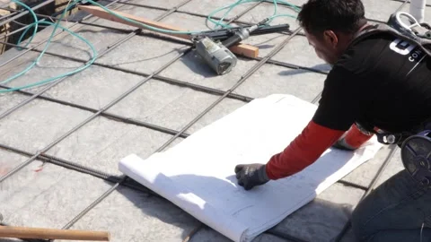 Worker looking at blueprints at a construction yard Stock-Footage 228794775