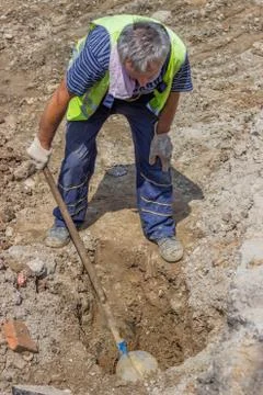 Worker looking for lost water pipe Stock Photos