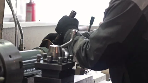 Worker on a machine lathe in factory. Machining process in the factory 스톡 동영상 60235701