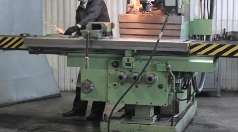 Worker on a machine lathe in factory. Machining process in the factory Stock Footage 60250029