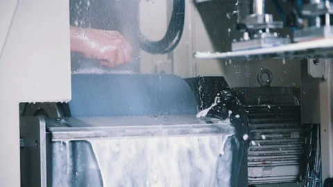 Worker maintaining stone grinding ski tuning machine Stock Footage 94194528