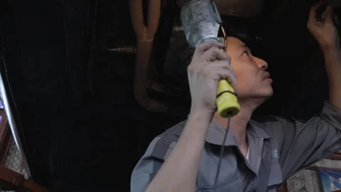 Worker maintenance under the car Stock Footage 177935795