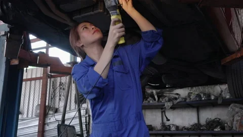 Worker maintenance under the car Stock Footage 177939457