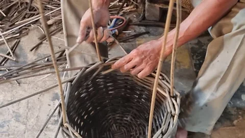 Worker make a bucket from rattan Stock Footage 264872104