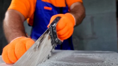 Worker makes an apartment repair, cuts plates Stock Footage 114894709