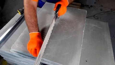 Worker makes an apartment repair, cuts plates Stock Footage 114894796