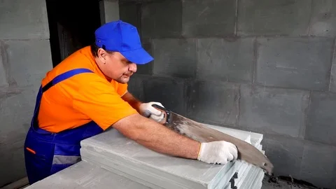 Worker makes an apartment repair, cuts plates Stock Footage 114895659