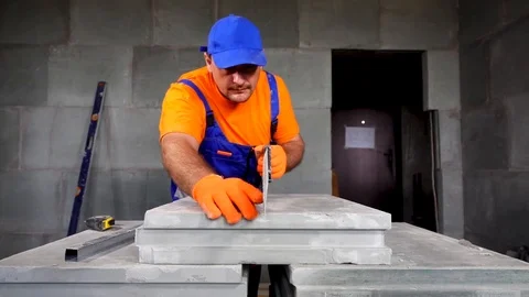 Worker makes an apartment repair, cuts plates Stock Footage 114896143