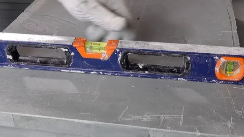 A worker makes an apartment repair, measures with a tape measure Stock Footage 114896040