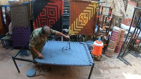 Worker makes a bed. Pakistan Stock Footage 113594903