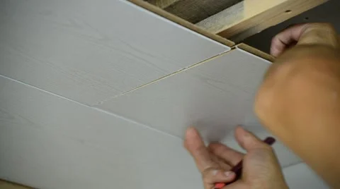 Worker makes the ceiling of MDF panels Stock Footage 67825797