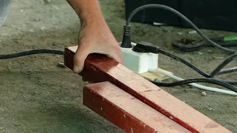 A worker makes markings on a metal bar. Slow motion. Stock-Footage 88339910