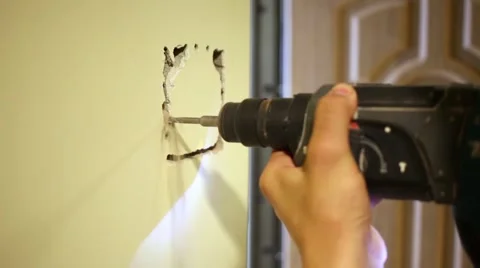 Worker makes quadrangular shape trench in wall Video stock 51876195