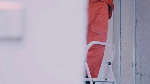 Worker makes repairs in the room Video stock 77350630